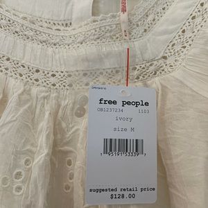 NWT. Free people ivory blouse. Size medium.